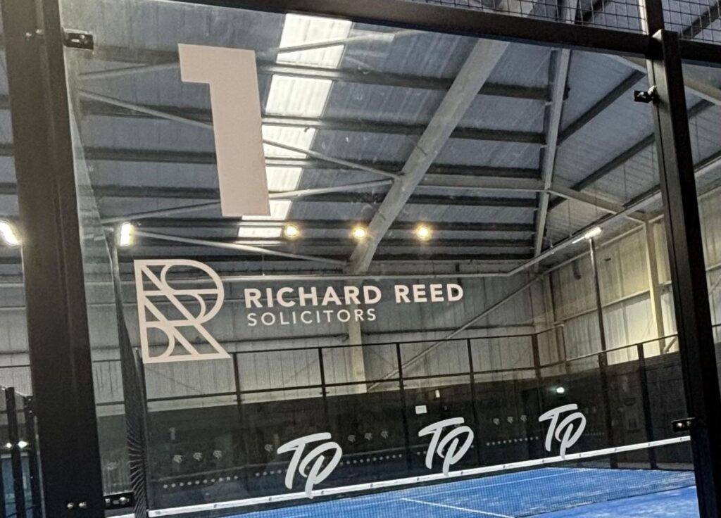 Richard Reed logo on paddle court